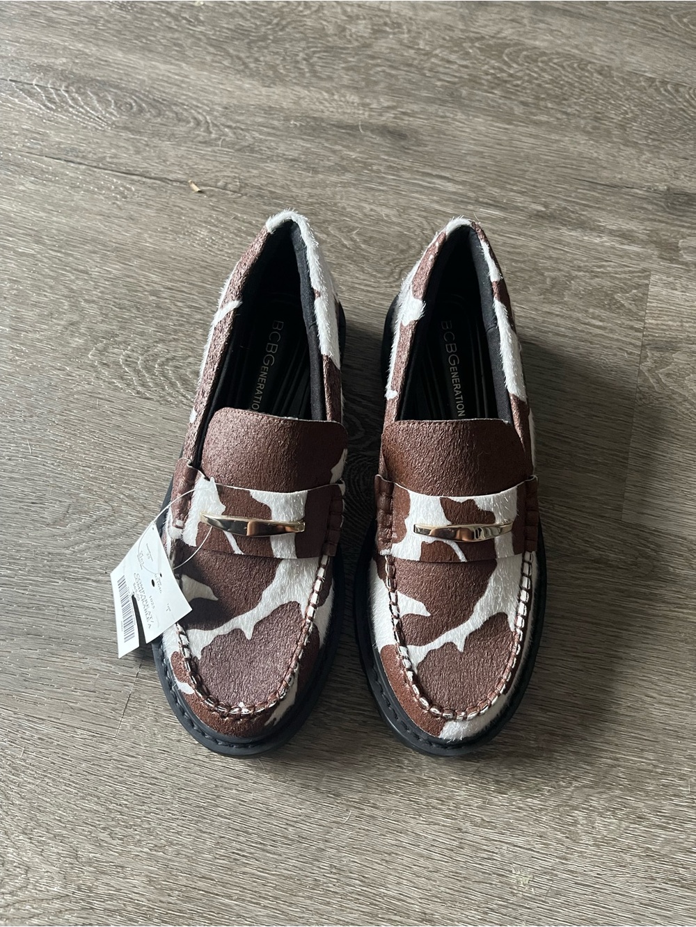 BCBGeneration Women’s Brown and White Cowhide Penny Loafers